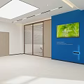 Modern Office Corridor Featuring Blue Wall Reception Desk Hanging Pendant Lights And Glass Door