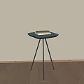 Stylish Green Hexagonal Side Table With Black Tripod Legs And Book On Top 3d model