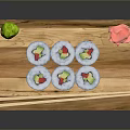 Fresh Sushi Rolls On Wooden Tray With Avocado Rice Nori Pickled Ginger And Wasabi