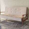 Beige Button Tufted Armchair With Wooden Armrests And Metal Legs In Marble Floor Room Setting