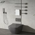Modern Gray Toilet in Contemporary Bathroom with Shower Fixture Towel Rack and Potted Plant
