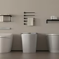Modern Three Toilets In Bathroom Interior With Towel Racks Shelves And Towels