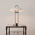 Modern Table Lamp with White Lampshade and Black Metal Stand on Black Table