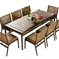 Wooden Outdoor Table with Eight Rattan Chairs and Decorative Centerpieces for Garden Patio