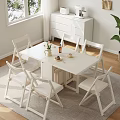 Minimalist White Dining Table And Chairs Set With Decorative Items In Bright Living Room