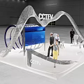 Modern CCTV Exhibition Booth With Curved Structure Blue Screen And People Around