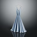 Elegant light blue long dress with pleated design hanging on hanger against dark background