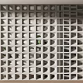 Modern White Geometric Room Divider With Hollow Design And Green Plants