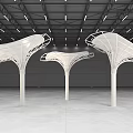Modern Sculptural Pillars in Industrial Interior Space with Canopy Like Tops and Ceiling Lights