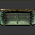 Ornate Green Velvet Sofa With Golden Carved Accents And Wooden Legs