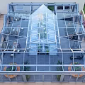 Glass Greenhouse Style Restaurant With Transparent Roof Dining Area And Indoor Plants