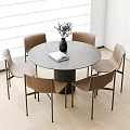 Modern Round Dining Table Set With Brown Chairs Vase Book And Wooden Floor