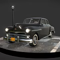 Vintage Black Classic Car Display With Street Lamp On Circular Wet Paved Ground