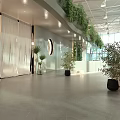 Modern Front Desk Reception Area with Green Plants Circular Decor and Sofa