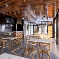 Rustic Restaurant Design Featuring Wooden Facade Outdoor Tables And Chairs