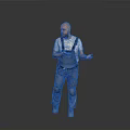 Male Worker In Denim Overalls With Knee Pads Standing And Gesturing On Gray Background