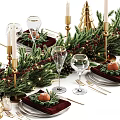 Christmas Themed Tableware Set With Greenery Red Placemats Gold Cutlery Wine Glasses And Oranges