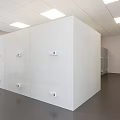 Modern Office Partition Area With Gray White Walls Drawer Cabinets And Ceiling Lights