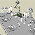 Elegant Dining Table Set With Carved Chairs Blue Cushions And Decorative Flowers