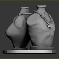 Elegant Necklaces Showcased On Grey Torso Mannequins With Silver Base Display Stand