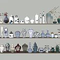 Various Decorative Vases In Different Styles And Colors On Shelves With Floral Branches