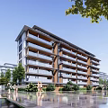 Modern Multi Storey Apartment Building With Balconies And Waterfront Landscaping