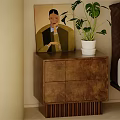 Brown Wooden Bedside Table With Drawers Potted Plant And Wall Artwork Near Bed