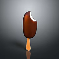 A Bitten Chocolate Ice Cream Bar on Wooden Stick Against Dark Background