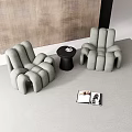 Leisure Sofa Set with Two Comfortable Chairs Small Table and Magazine on Textured Wall