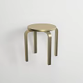 Brass Stool With Round Seat And Curved Legs In Modern Minimalist Design On White Background