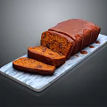 Homemade Fruit Loaf With Chocolate Glaze Sliced On Marble Serving Board