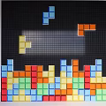 Black Grid Background Wall With Colorful Tetris Inspired Blocks And Vibrant Multicolored Design