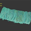 Mountainous Terrain With Blue Gray Rocky Layers Canyon Green Vegetation And Textured Surface