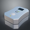 Sleek Silver Computer Accessory With LCD Display And Circular Control Button