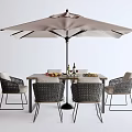 Patio Outdoor Dining Table With Wicker Chairs Sunshade Umbrella And Wine Glasses