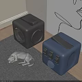 Gray Cat Resting Near Two Cube Shaped Gray And Blue Cat Beds