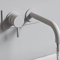 Wall Mounted Black Faucet with Dual Handle Running Water on Gray Wall