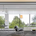 Modern Office Interior With White Bookshelves Red Chair Glass Desk Laptop And Green View