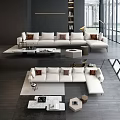 Modern Living Room Interior With White Multi Seater Sofa Brown Cushions Coffee Table And Bookshelf