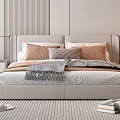 Modern Elegant Bedroom With Beige Headboard Brown Gray Pillows Fringed Blanket And Books On Carpet