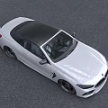 White BMW Convertible Sports Car With Black Top And Stylish Front Design