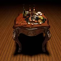 Elegant Wooden Table With Wine Bottles Wine Glasses Fruits And Teacup On Carved Wooden Floor