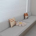 Modern Bay Window Cabinet with Cushioned Seat Decorative Pillows and White Blinds