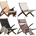 Stylish Lounge Chairs With Woven Seats Wooden Frames And Decorative Throws