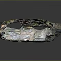 Natural Rock Cave Landscape Featuring Overhead Openings Mossy Ground and Rocky Formations
