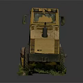 Old Yellow Road Roller Abandoned with Overgrown Grass and Weeds