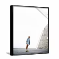 Portrait of a Woman in Light Blue Coat by Modern Gray Wall and White Architecture