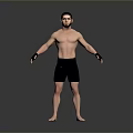 Shirtless Man in Black Shorts with Wrist Wraps Standing on Grey Background
