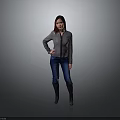 A Stylish Woman In Gray Jacket Blue Jeans And Black Boots With Hand On Hip
