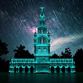 Illuminated Blue Tower With Star Trails And Milky Way In Night Sky Surrounded by Trees